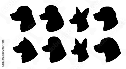 Collection of black silhouettes of dog faces. Profile front.