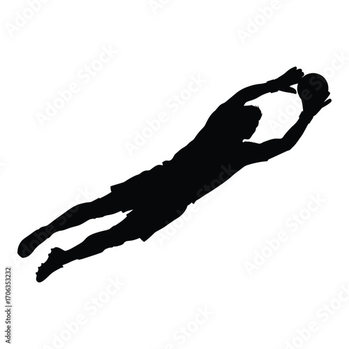 Silhouette of soccer goalkeeper diving to catch the ball action sport photography silhouette