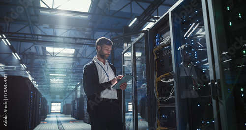 Technician works in data center.