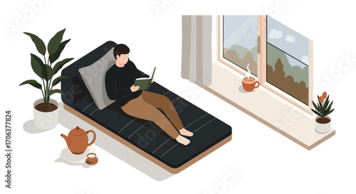 Cozy reading corner with a man relaxing by the window in a minimalist flat de…