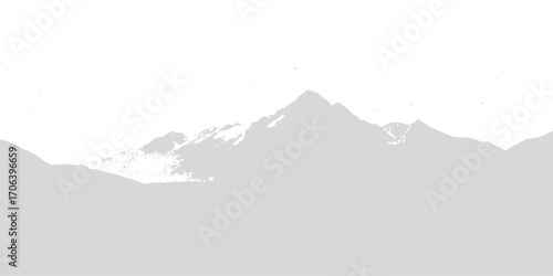 Snow-covered peaks and a high mountain landscape with fog and clouds at sunrise