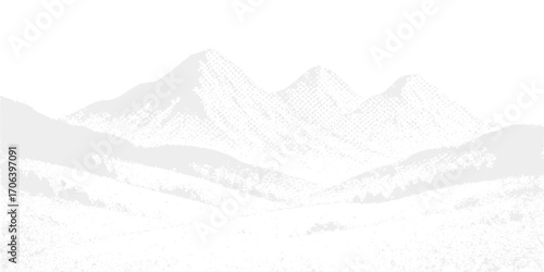 A cold winter landscape with snow-covered mountain peaks under a clear blue sky