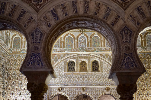 Intricate Moorish Architecture in the Royal Alcazar of Seville, Spain: Ornate Arches, Detailed Tilework, and Stunning Patterns
