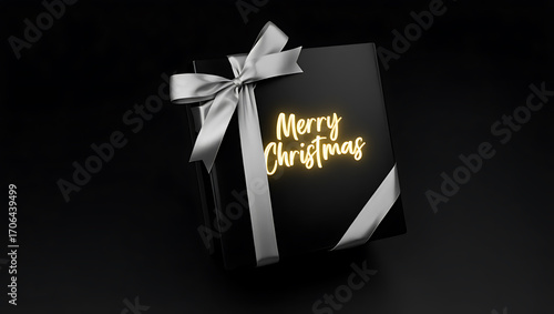 Elegant black gift box with a silver ribbon and merry christmas text