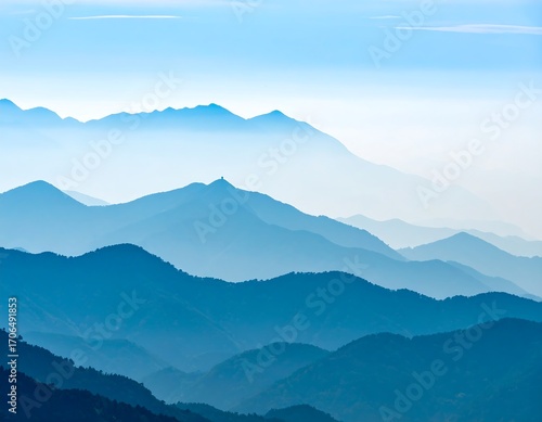 Misty mountain ranges in shades of blue