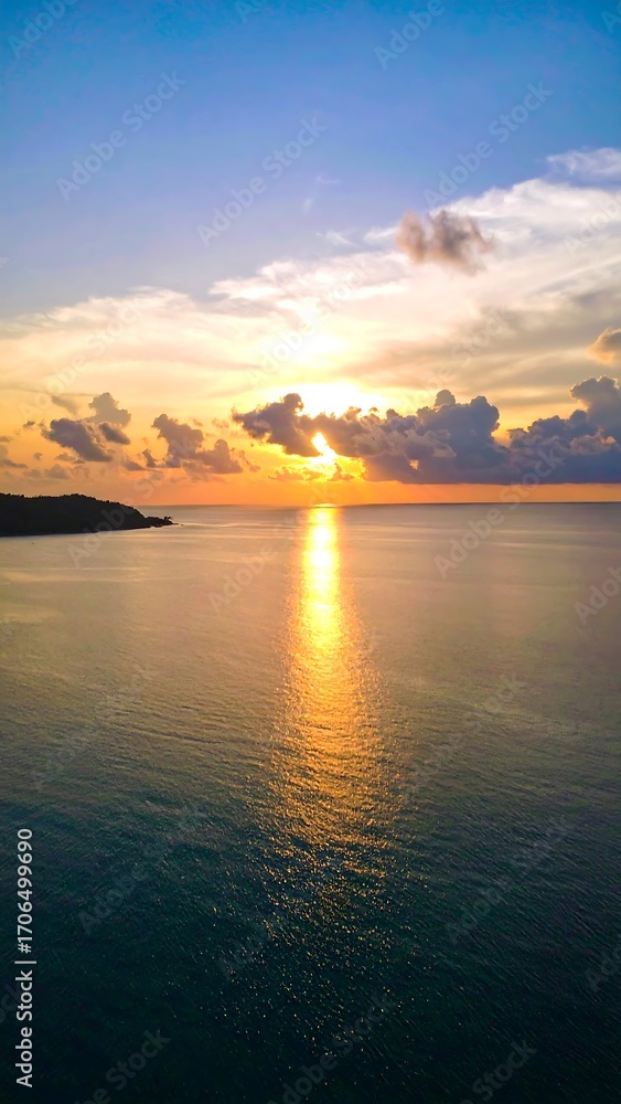 Fototapeta premium Sunset over a calm ocean