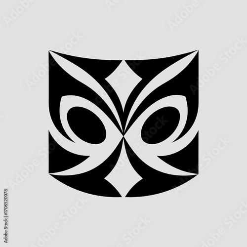 Abstract black tribal mask design with stylized eyes and diamond shapes on a light gray background minimalist graphic art