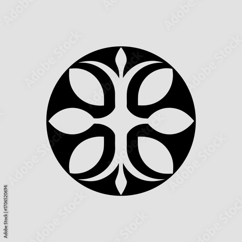 Elegant black circular floral motif with symmetrical petal like shapes and a central diamond element on a light gray background