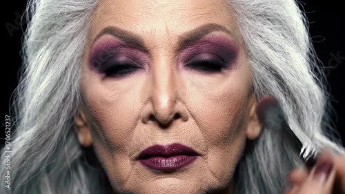 Makeup application transformation on mature skin in a professional setting