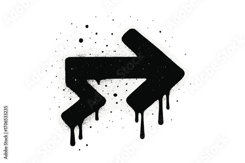 Black graffiti arrow with splatter effects creates an expressive urban art statement