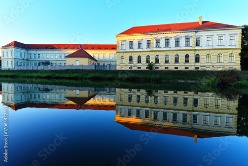 19 century high school reflection in the lake.