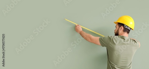 Male worker measuring green...
