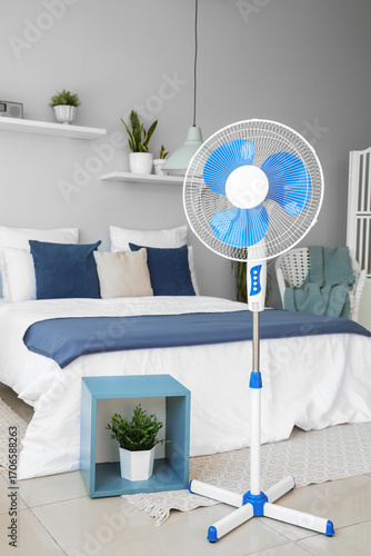 Floor fan and cozy bed in i...
