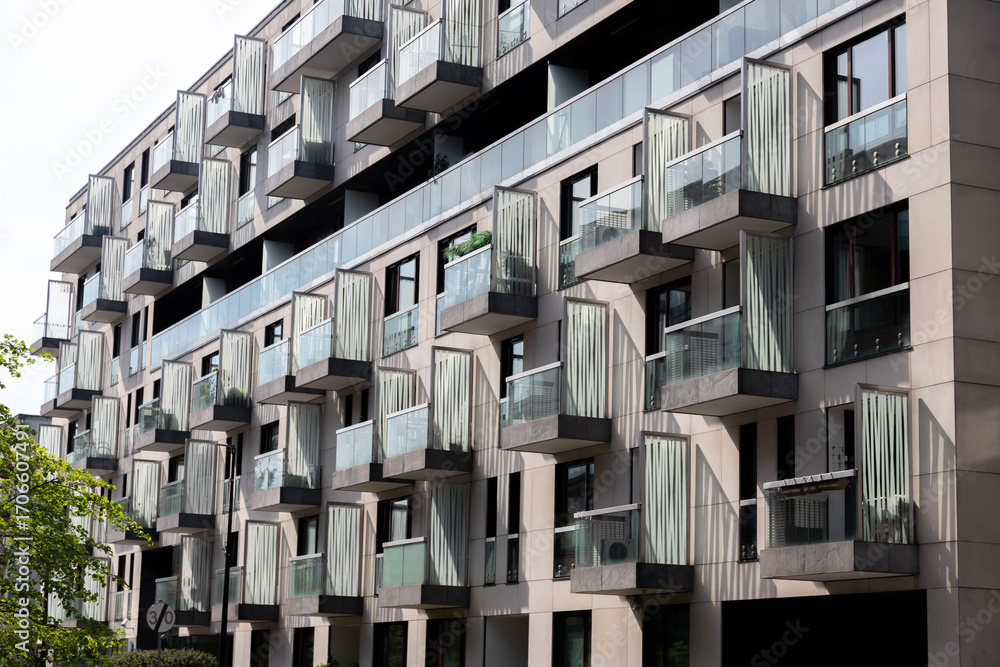 Obraz premium Residential building. bottom view. Modern apartment building on a sunny day.