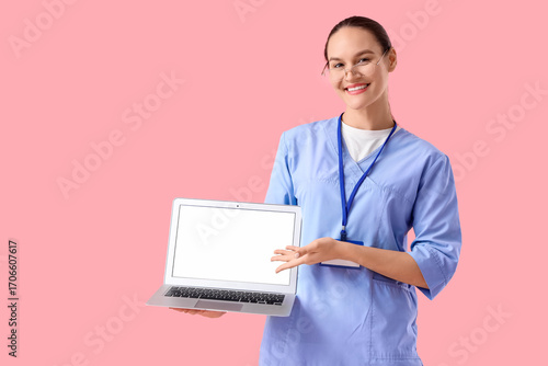 Female doctor showing blank...