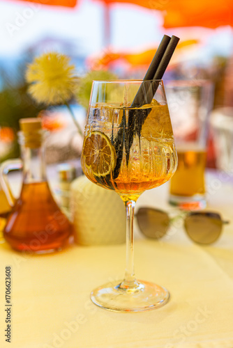 A peach spritz cocktail in the restaurant on the sea shore