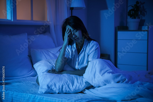 Young Asian woman suffering...