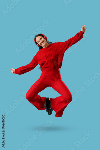 Young happy woman in headph...