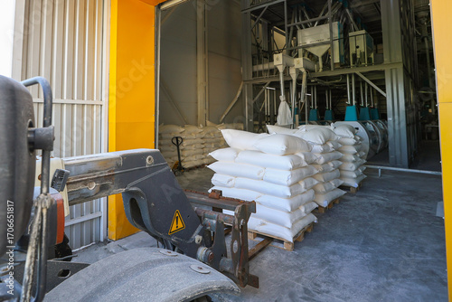 Flour bags in a mill stock image