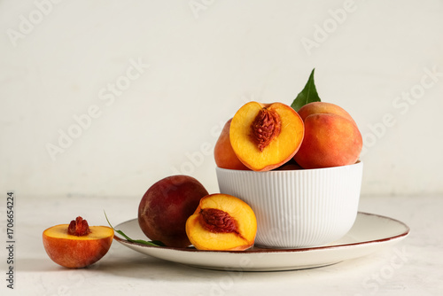 Fresh ripe peaches in white...
