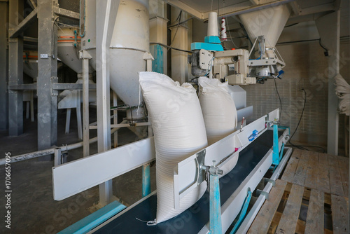 Flour bags in a mill stock image