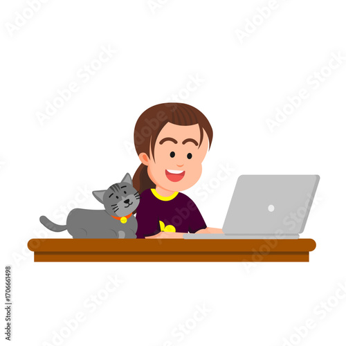 A little girl at her study desk with a cat beside the laptop