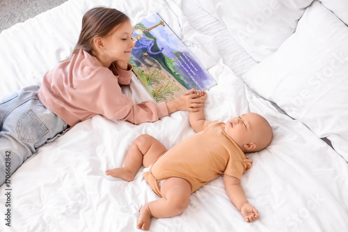 Cute little girl reading st...