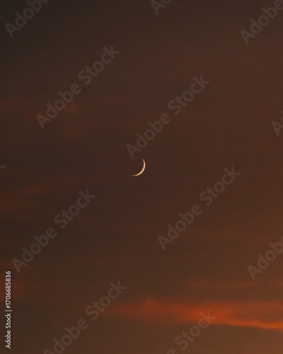Golden Twilight with Crescent Moon over the Sea