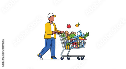 A happy young man pushing a supermarket shopping cart brimming with groceries on white isolated background