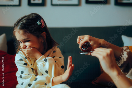 Uncooperative Child Refusing the Bad Taste of a Coughing Syrup. Kid hates the medicine she has to take for her cold 
