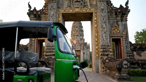Close up electric tuk tuk charging roadside station cinematic UHD sustainable transport stock footage. eco friendly auto rickshaw refill point ultra high definition green mobility