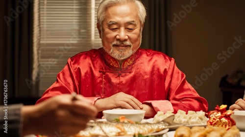 Grandfather blessing family first bite cinematic UHD handheld Lunar New Year lifestyle stock video. senior s benediction kin s initial taste filmic ultra hd portable spring