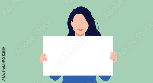 A young woman holds a blank white sign with both hands against a pastel green background.