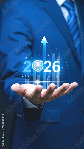 Businessman holds 2026 projected growth graphic