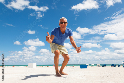 Handsome middle age man enjoying the beach