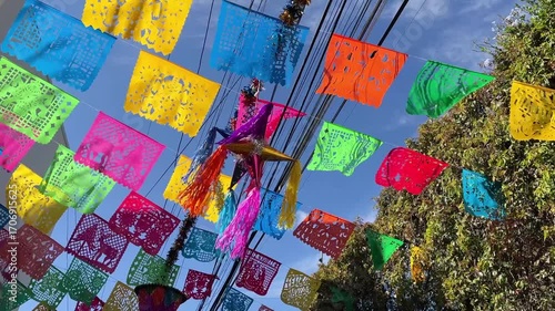 Traditional mexican papel picado decorating streets in mexico