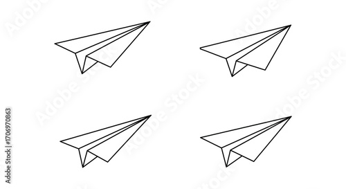 four paper airplanes arranged neatly in a square formation