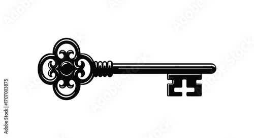 an antique key with intricate design and symmetrical patterns