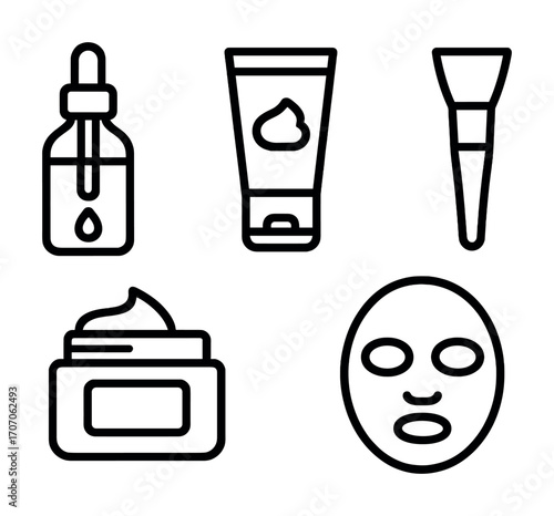 Skincare essentials: dropper, cream jar, face mask, tube, brush - cosmetic routine