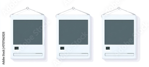 Three retro computer monitors hang against a white background, each with a gray screen, a disk drive, and a power button