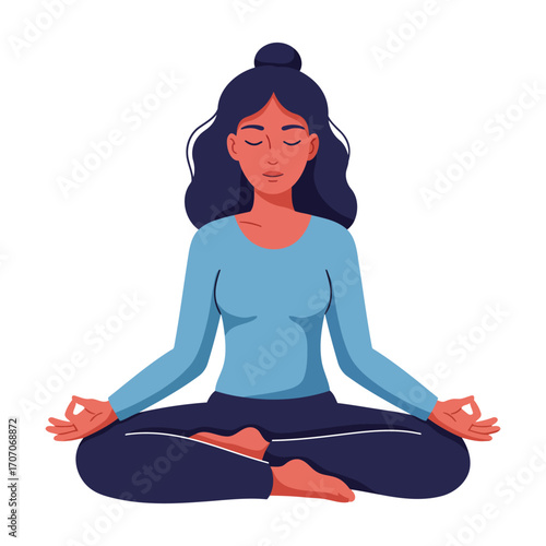 A woman with dark hair in a bun meditates in a lotus position with closed eyes, promoting peace and mindfulness.