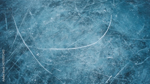 The blue ice texture in the background is marked from the activity of ice hockey skating