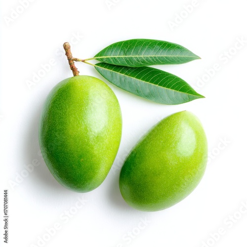 Against a transparent setting a fresh green mango is displayed with leaves and a sliced section