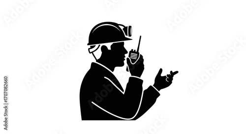 Construction worker using a two-way radio, communicating, gesturing, safety helmet.