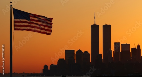 American flag and New York City skyline at sunset