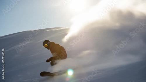 Snowboarder Carving Powder: Winter Sport Action in Mountain Sunlight