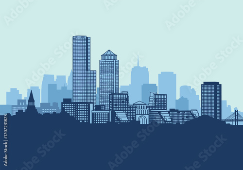Modern city skyline with tall buildings and a clear sky.