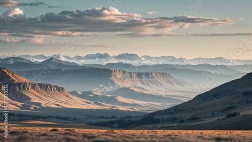 A serene mountain landscape with a fiery sunrise and a blanket of mist in the valley