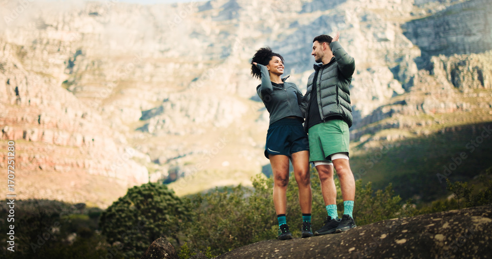 Obraz premium High five, hiking and couple with fitness, love and celebration with relationship, trekking together and goals. Outdoor, man and woman with challenge, explore or endurance with nature and achievement