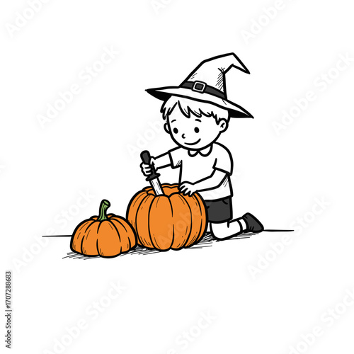 Young boy in witch hat carving pumpkin for Halloween  